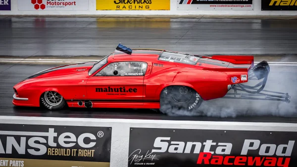 Andres Arnover (Estonia), burning the rubber in true Pro Mod fashion! Red Pro Modified Mustang Drag Car