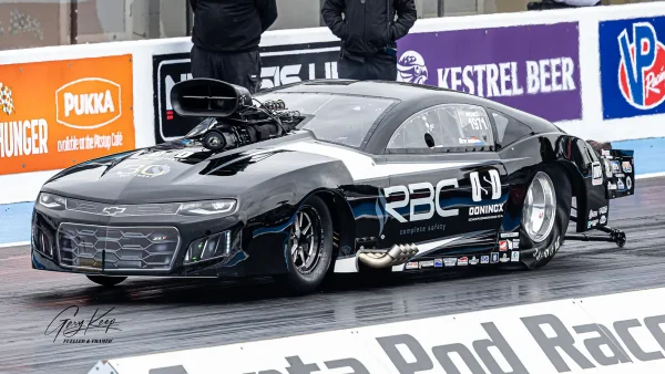 Michael Tooren hitting the load pedal in his Black Pro Mod Camaro ZL1 at Santa Pod Raceway